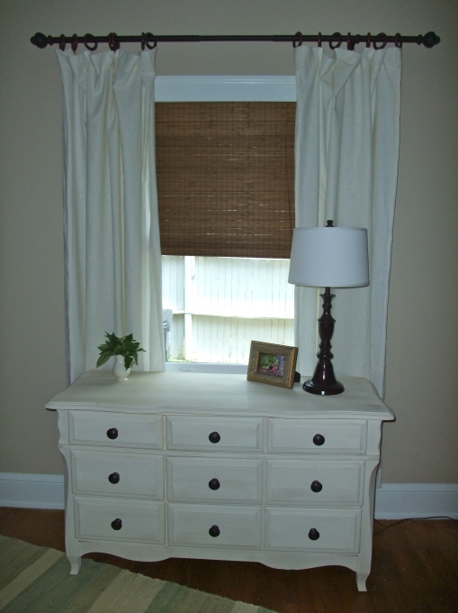 Annie Sloan's chalk paint: old white and old ochre with clear wax.  I painted the nightstands the same way, and the paint was a dream to work with!